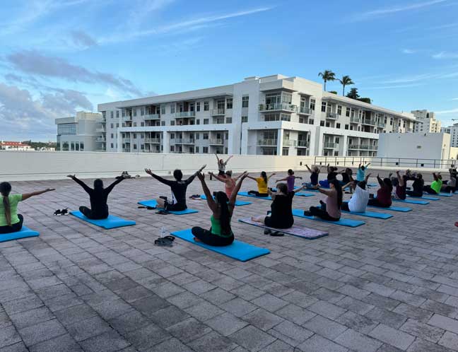 Clerk employees doing yoga on rooftop patio