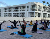 People doing yoga on a rooftop